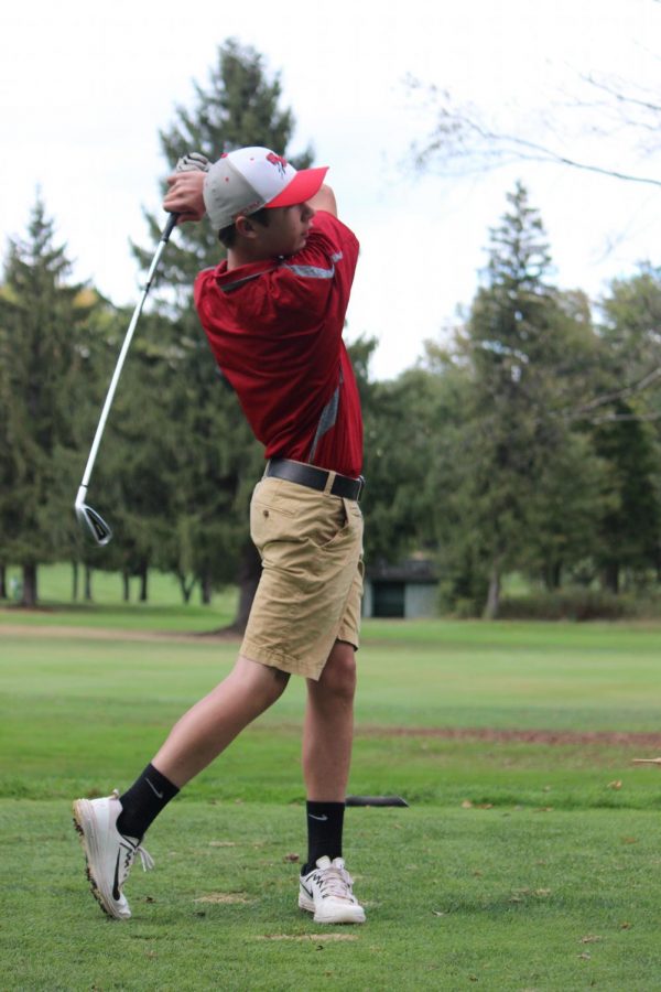 Shane Stevenson hits the ball with perfect form at meet against Grove City.
