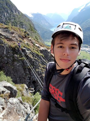 Ben Shumway takes a Selfie while rock climbing. 
