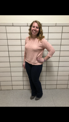 Junior Morgan Malinski wearing a pale pink sweater with a classic pair of jeans.