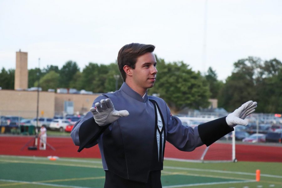 Senior Drum major Keven Rall leads the band at Franklin on September 4. As a three year drum major, which is a rare occurrence, Rall says, It feels great. Mr. Fine actually like me now. 