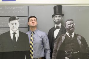 Mr. Miller stands proudly with his favorite president, TR, along with some other great leaders of our country. Miller said Roosevelt is his favorite president because of how he influenced the people of the United States. The way he could motivate people is definitely inspiring to me, he said.  Photo by Kenneth Foran