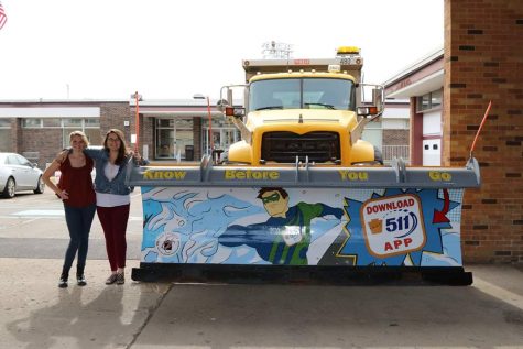 Plowing Through the Work Load. Seniors Ashton Rider and Abby Comes stand proudly next to their finished product after weeks of trail and error. The super hero design was created by Rider, and had help putting it on the plow from Comes and Senior Logan Tifel.  Photo courtesy of Ashton Rider 