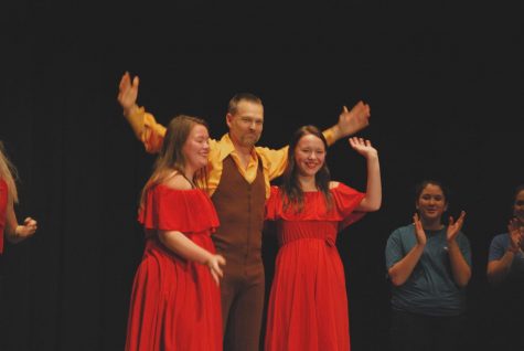 We Are the Champions!
Senior Grace Bell, Mr. Whitmer, and Senior Aizlynn Riefer accept the first place applause from the student body. Dancing with the Staff happened on November 20th. Photo taken by Olivia Tiche