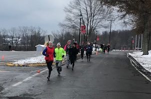 Dashing through the Snow! Teachers and students run and jog along the track. Dashing through the Rock took place on December 8th. Photo by Olivia Tiche