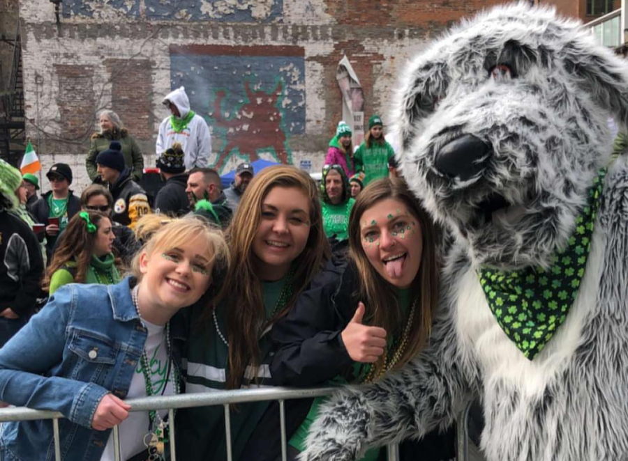 Luck o' the Irish. Makenzie Callihan, Meckenzie Pflueger, and Jordyn Kreutz pose for a photo with Finn the Irish Wolfhound, the mascot for Pittsburgh's St. Patrick's Day parade. The girls attended the parade on March 16th. Photo courtesy of Meckenzie Pflueger.