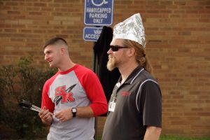 Not My Hair - Mr. Elford prepares for the rain with his stylish tin foil hat.
