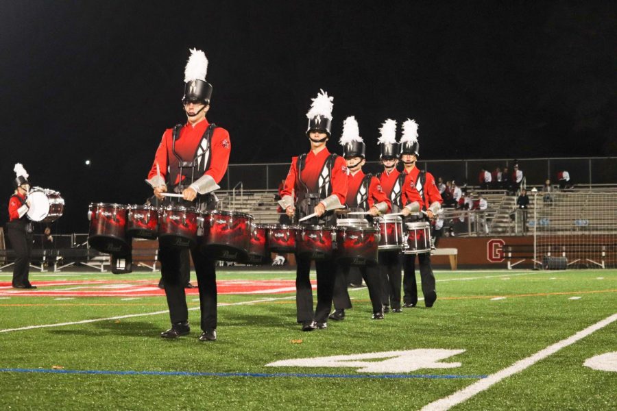 Members+of+the+drumline%2C+including+senior+Greg+Pritts+and+junior+Christian+Shaffer%2C+play+the+tenors+during+the+Grove+City+College+Marching+Band+Invitational+on+October+12.