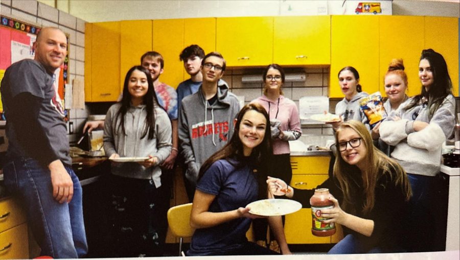 Members of the Miscellaneous Club smile after enjoying a period of learning how to make quesadillas. Front Row: Harley Pflugh, Grace Sybert | Row 2: Mr. Campagna, Alexis Vajda, Tyler McCandless, Anna Fogel, Sophie SPence, Samantha Hayes, Haleigh Fish | Row 3: Kurtis Baxa, Evan Long